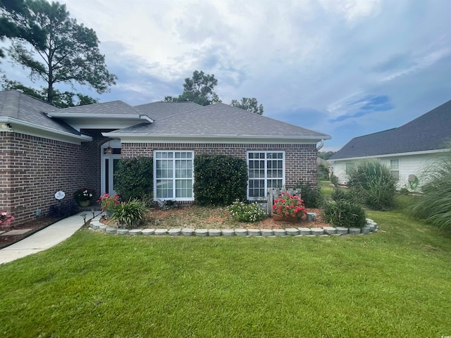 exterior space featuring a lawn