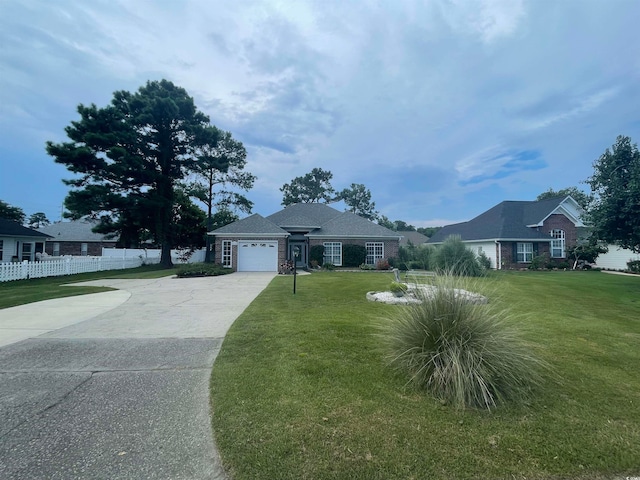 single story home with a garage and a front yard