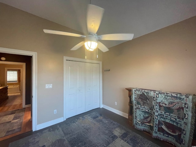 unfurnished bedroom featuring a closet, ceiling fan, and dark hardwood / wood-style floors