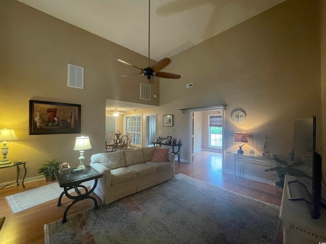 living room featuring high vaulted ceiling, ceiling fan, and hardwood / wood-style flooring