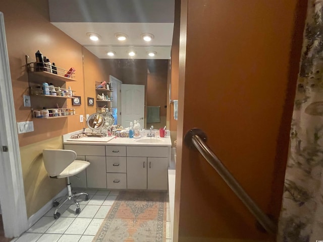 bathroom with tile patterned flooring and dual vanity