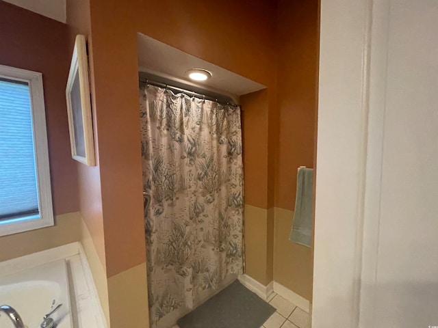 bathroom with tile patterned flooring