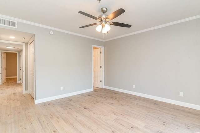 empty room featuring ornamental molding, light hardwood / wood-style flooring, and ceiling fan