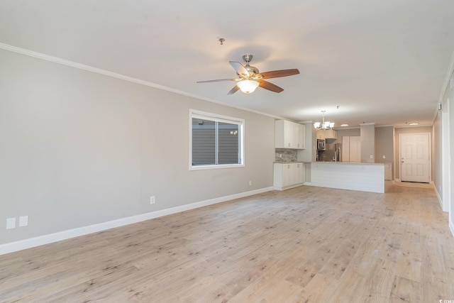 unfurnished living room featuring ceiling fan with notable chandelier, light hardwood / wood-style flooring, and ornamental molding