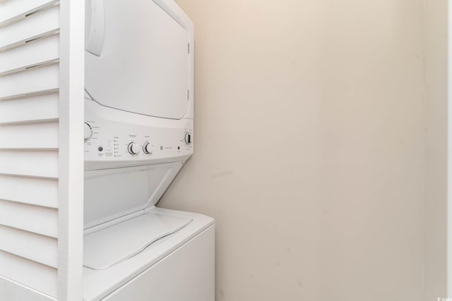 laundry area with stacked washer and clothes dryer