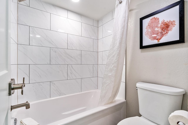 bathroom with toilet and shower / tub combo