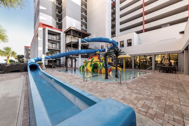 view of swimming pool featuring a water slide