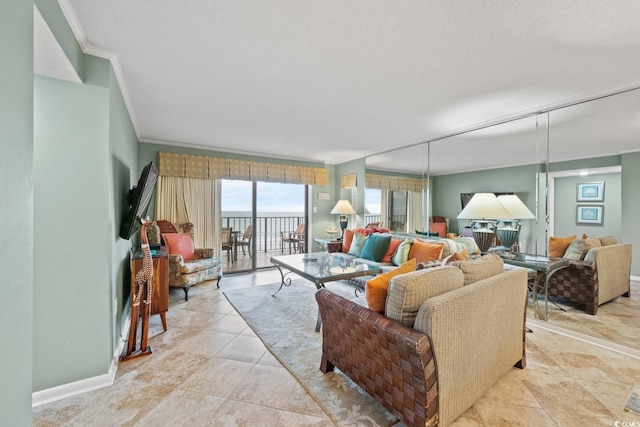 tiled living room with a textured ceiling and crown molding