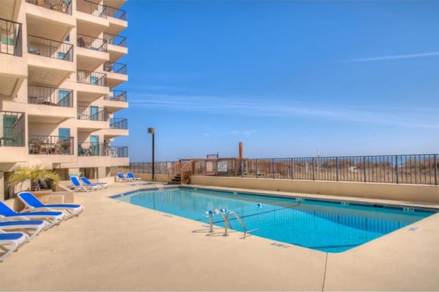 view of pool featuring a patio area