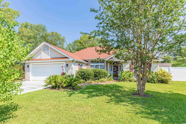 view of front facade featuring a front lawn and a garage