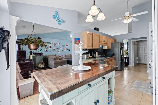 kitchen with sink, decorative backsplash, appliances with stainless steel finishes, light tile patterned floors, and ceiling fan