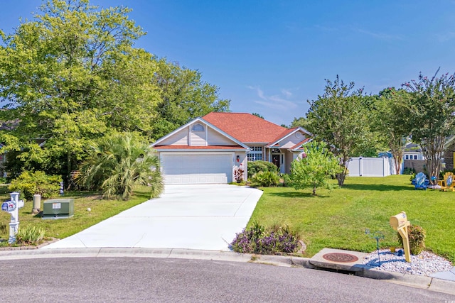 view of front facade featuring a garage and a front yard