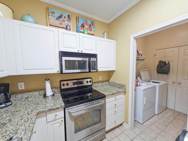 interior space with hanging light fixtures, stainless steel appliances, ornamental molding, and white cabinets