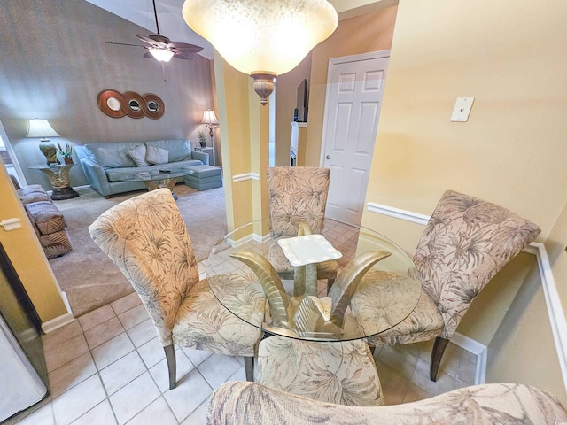 dining area with light tile patterned floors and ceiling fan