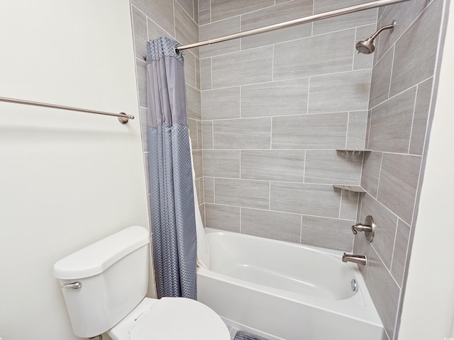 bathroom with toilet and shower / bath combo with shower curtain