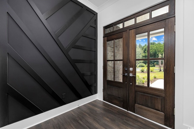 entrance foyer with plenty of natural light, dark hardwood / wood-style floors, and french doors