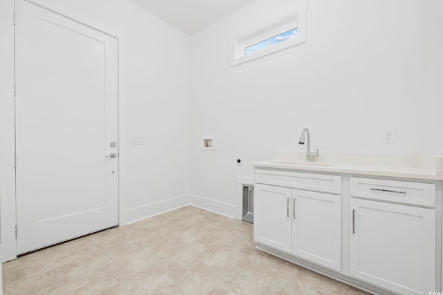 washroom featuring hookup for an electric dryer, washer hookup, cabinets, and sink