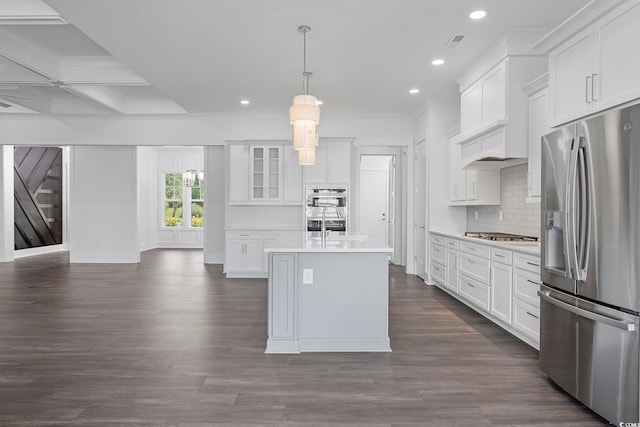 kitchen featuring appliances with stainless steel finishes, coffered ceiling, beam ceiling, pendant lighting, and white cabinetry