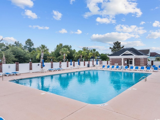 view of swimming pool with a patio