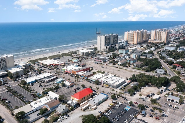 bird's eye view with a water view and a view of the beach