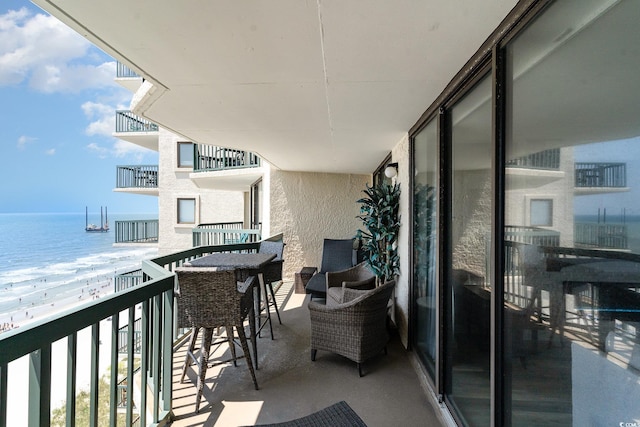 balcony featuring a water view