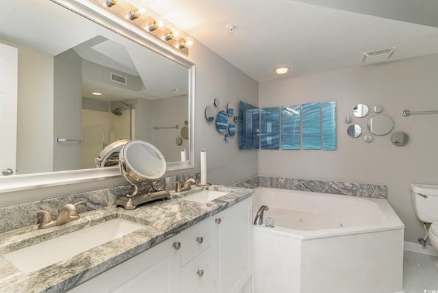 bathroom featuring walk in shower, double sink vanity, and toilet