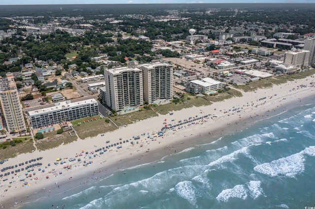 aerial view with a water view and a view of the beach