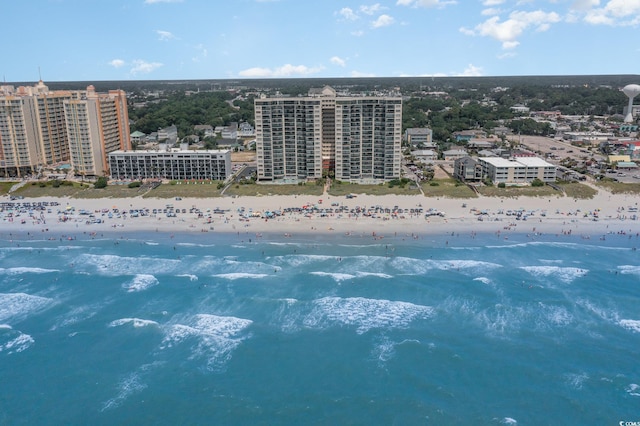 birds eye view of property with a beach view and a water view