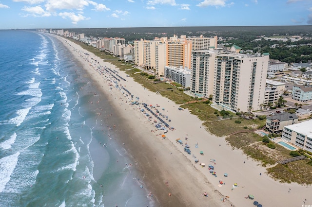 aerial view with a water view and a view of the beach