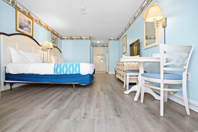 bedroom with wood-type flooring