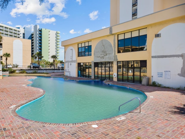 view of pool featuring a patio area