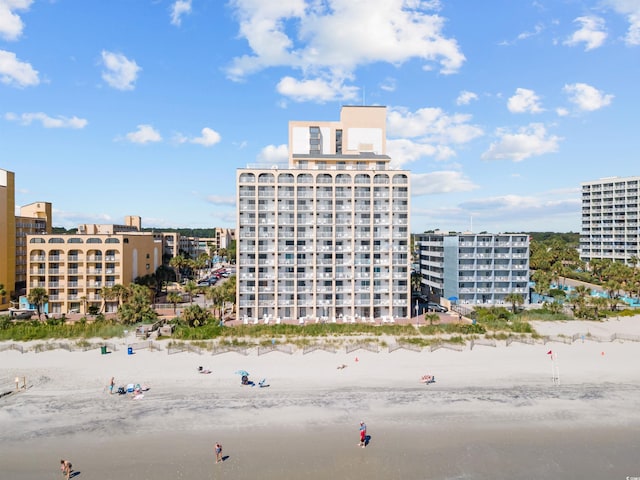 view of property featuring a water view and a view of the beach