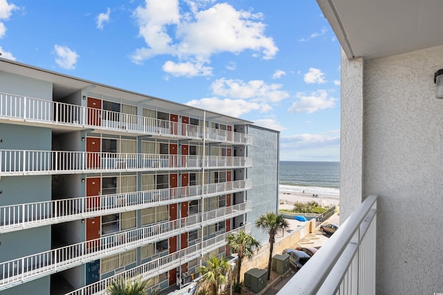 balcony with a view of the beach and a water view