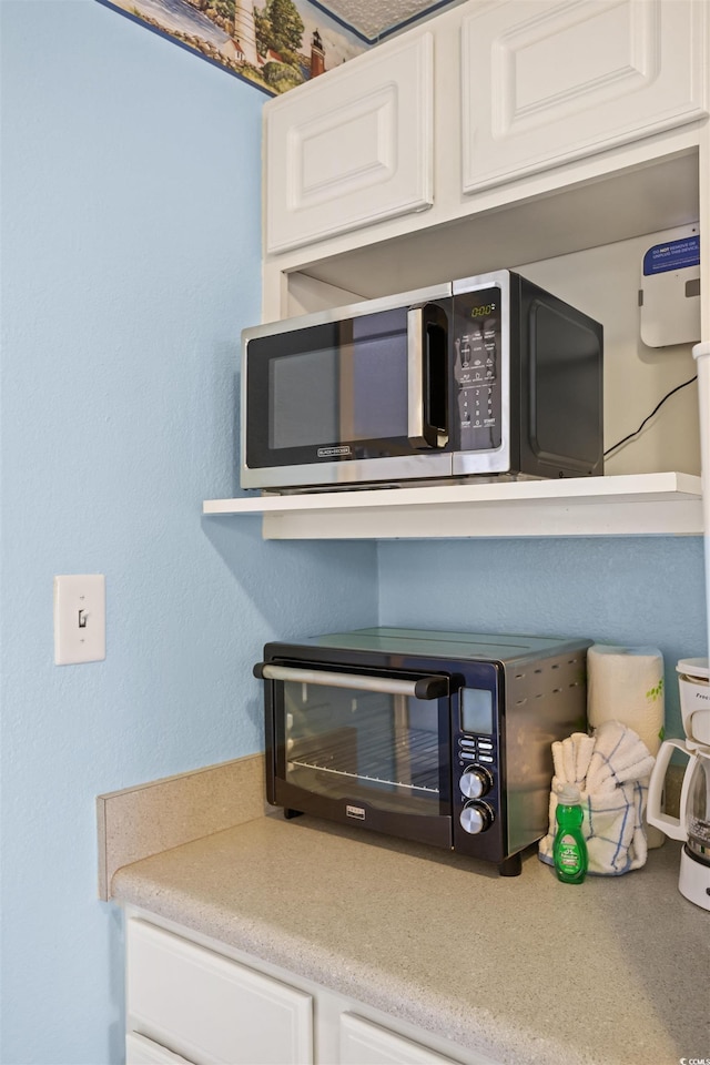 details featuring white cabinetry