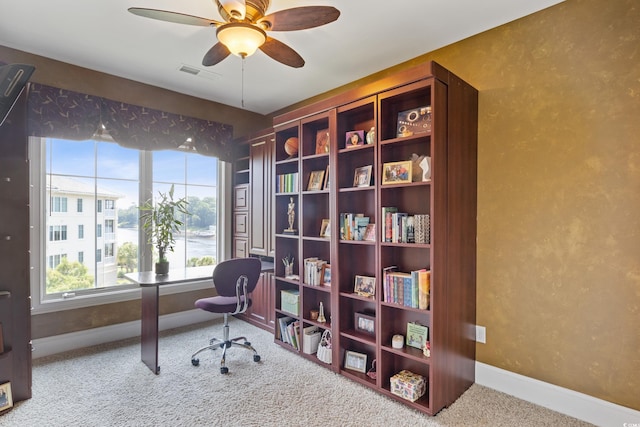 office with carpet flooring and ceiling fan