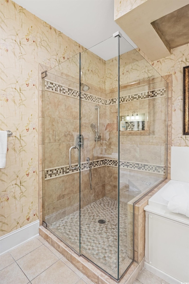 bathroom with tile patterned flooring and a shower with shower door