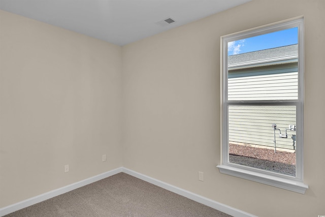 unfurnished room featuring carpet flooring