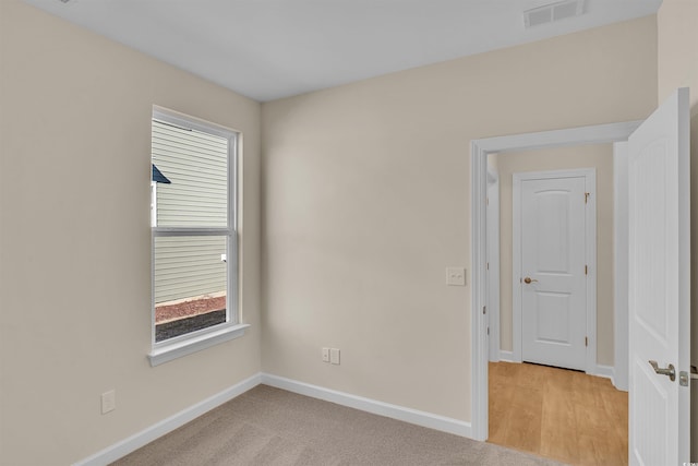 view of carpeted spare room