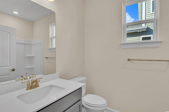 bathroom with vanity and toilet