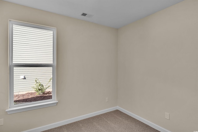 empty room featuring carpet flooring