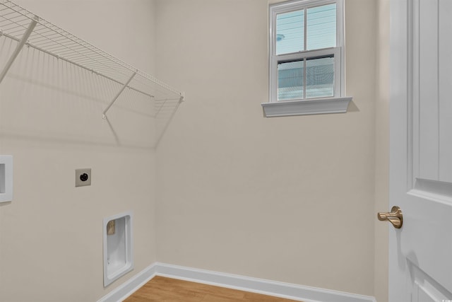 washroom featuring washer hookup, hardwood / wood-style floors, and electric dryer hookup