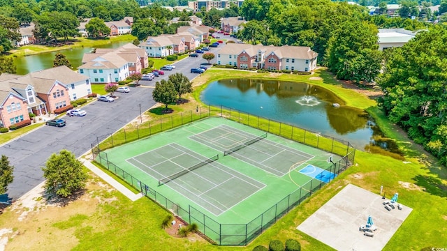 birds eye view of property featuring a residential view and a water view