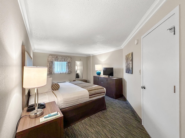 bedroom with ornamental molding, a textured ceiling, and dark colored carpet