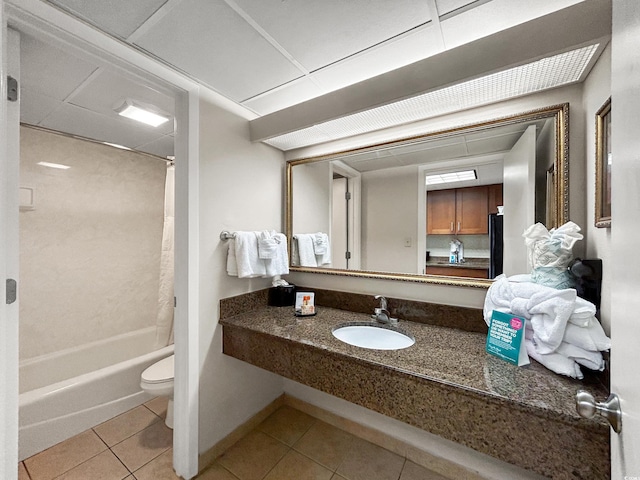 full bathroom featuring shower / tub combo with curtain, tile patterned floors, toilet, and sink