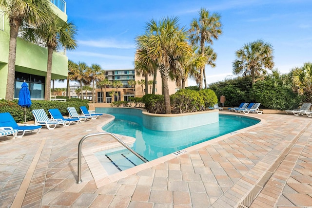 view of swimming pool featuring a patio area