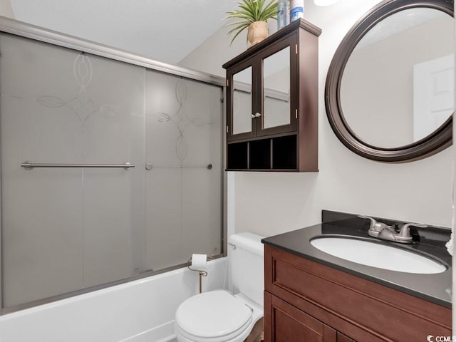 full bathroom with toilet, combined bath / shower with glass door, and vanity