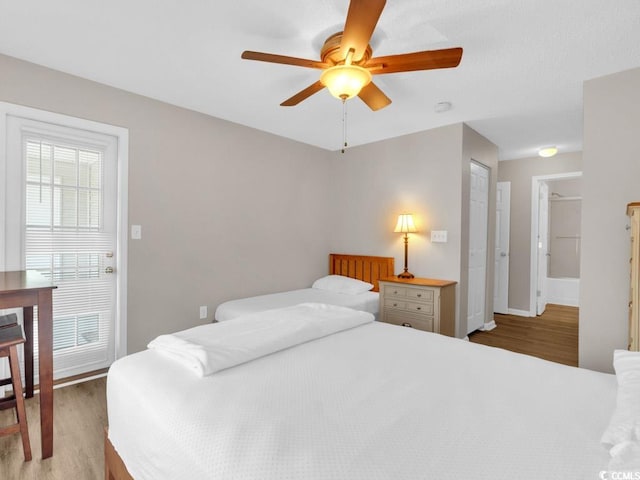 bedroom with ceiling fan and hardwood / wood-style flooring