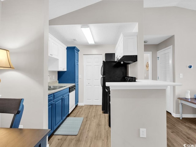 kitchen featuring light hardwood / wood-style flooring, blue cabinets, white cabinetry, and sink