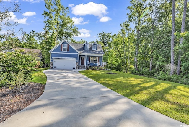 view of front of home with a garage, covered porch, and a front lawn