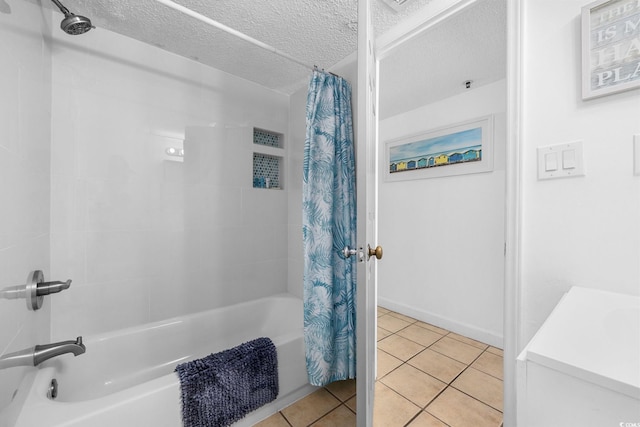 full bathroom with tile patterned flooring, shower / bath combo, and a textured ceiling